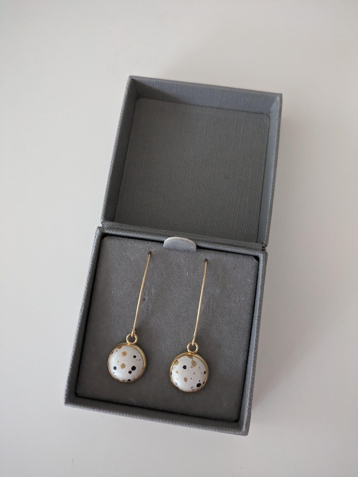 Earrings Pearly White leather with Black Print & Gold Flecks Golden Stainless Steel V Shape Drops homeware shops bristol gift shops bristol Bex & Bolt