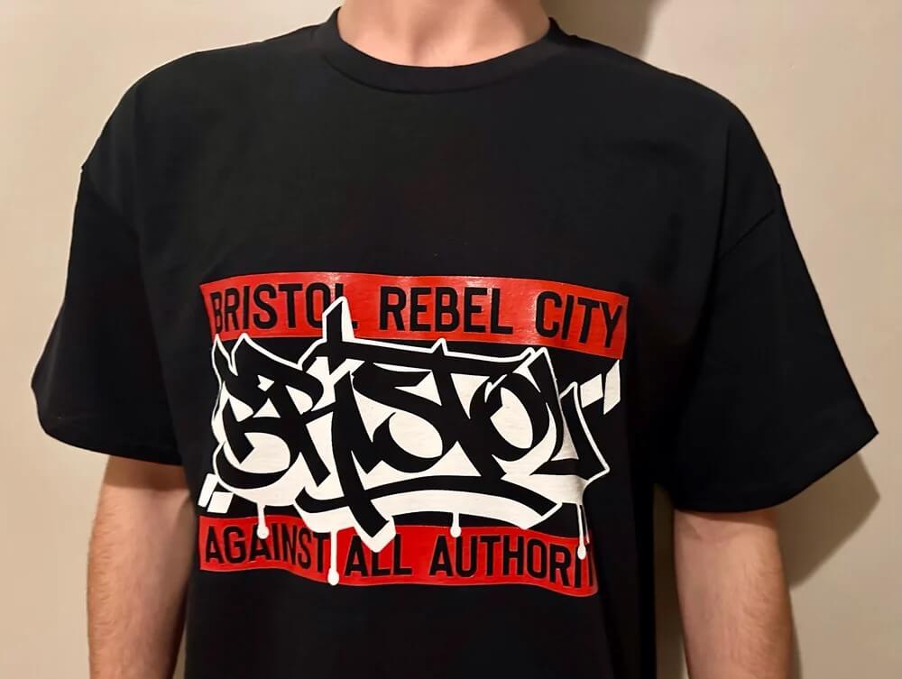 Clothing Graffiti Print Black T-Shirt - Bristol Rebel City (Against All Authority) homeware shops bristol gift shops bristol The Inkporium